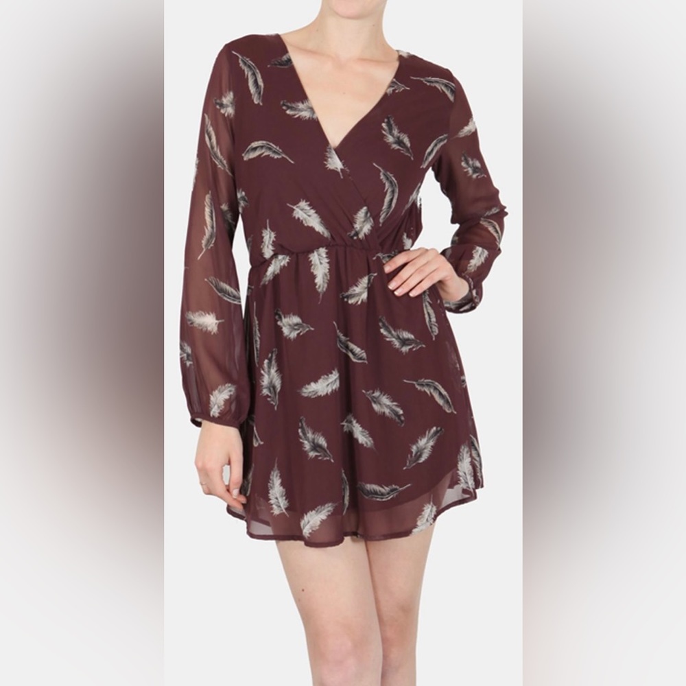 Final Touch Wrap top dress with semi sheer sleeves.
